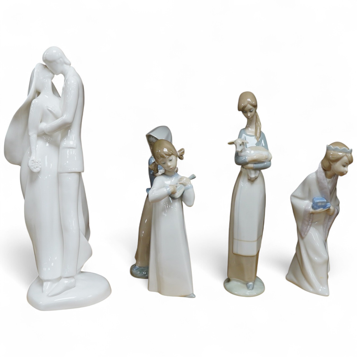 A Royal Doulton Images group and four LLadro figures